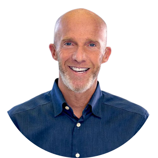 Headshot of David Kristal, a bald white man with a trim beard. David is wearing a navy blue collared button shirt and smiling.